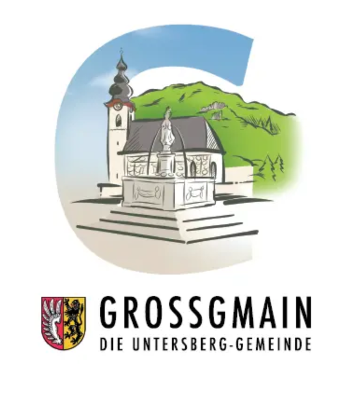 Das Logo der Gemeinde Großgmain zeigt einen gezeichneten Marktplatz mit Brunnen und Kirche.  Und einen Schriftzug: Großgmain - die Untersberg Gemeinde.