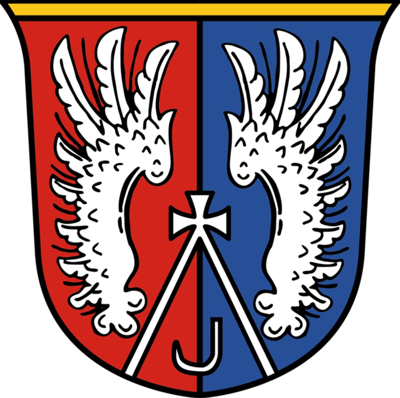 Das Wappen von Lamprechtshausen ist rot-blau vertikal halbiert mit jeweils einer gespiegelten Vogelschwinge auf jeder Seite.